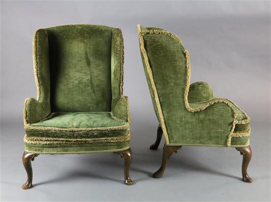 A pair of 19th century George I style mahogany wing armchairs, W.2ft 5in. H.3ft 6in.